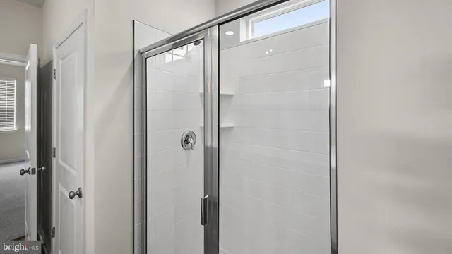 a bathroom with a double vanity sink and mirror