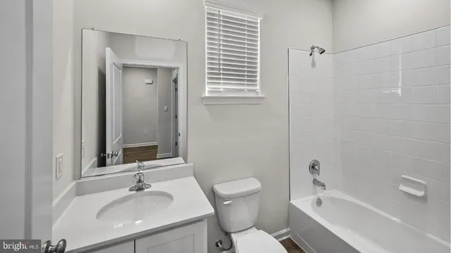 a view of a bathroom from the hallway
