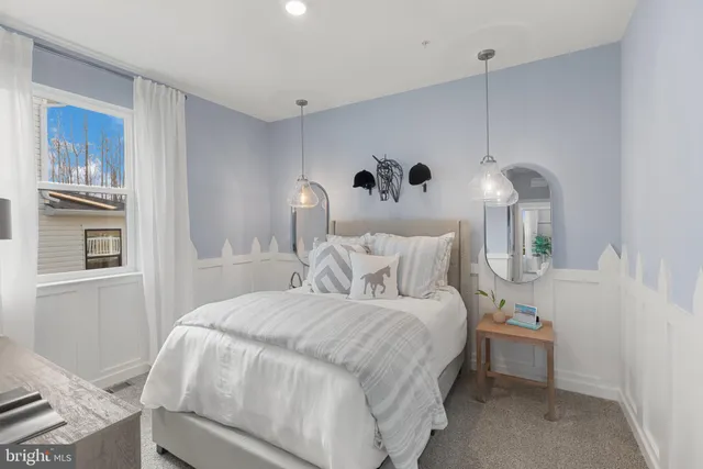 a bedroom with a bed and a table