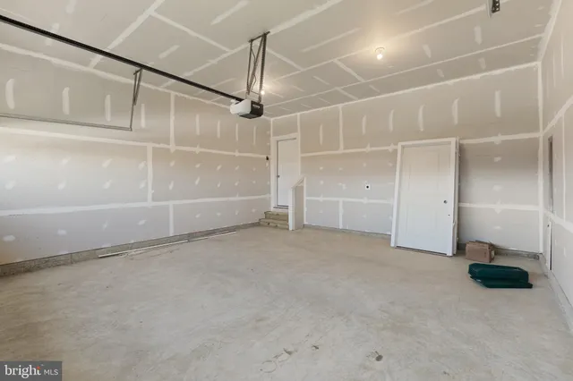 a view of an empty room with wooden roof