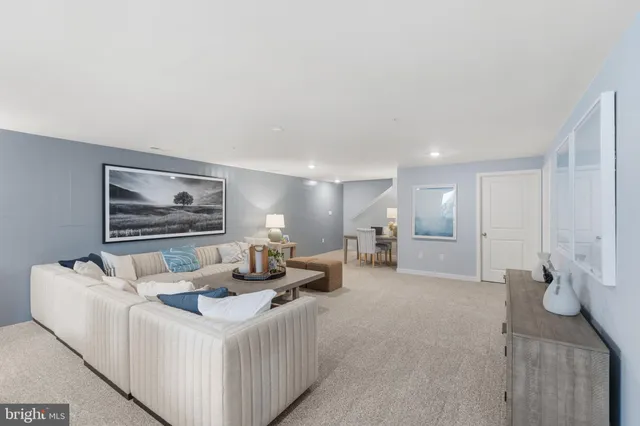 a living room with furniture and a couch