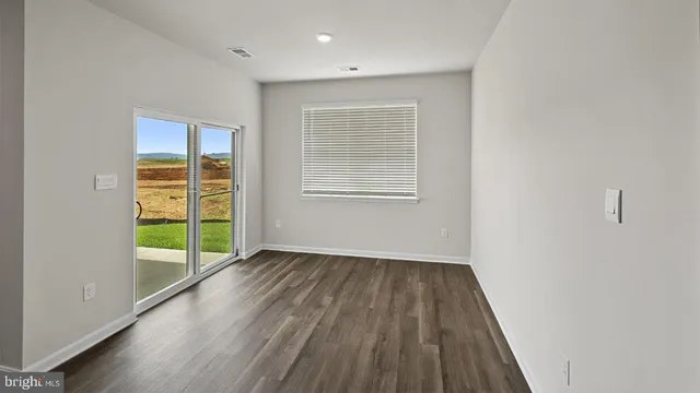 a view of kitchen with wooden floor
