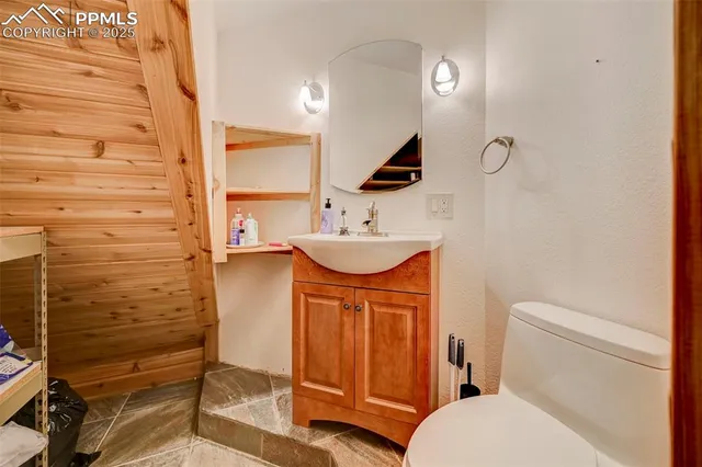 a view of two chairs in the balcony