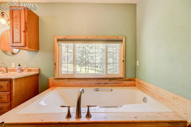 a view of a dining room with furniture large windows and wooden floor