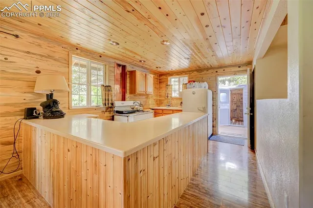 a front view of a house with outdoor seating