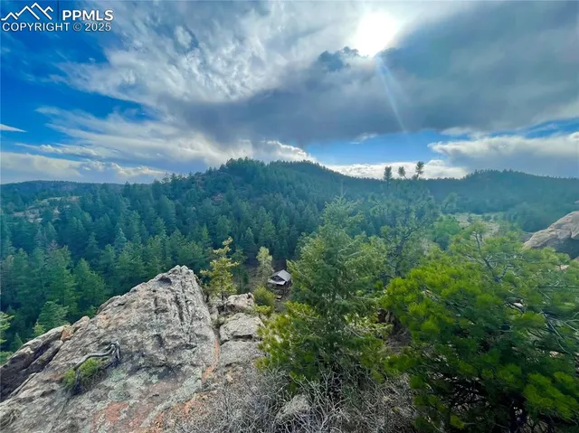 a backyard of a house with a yard and outdoor seating