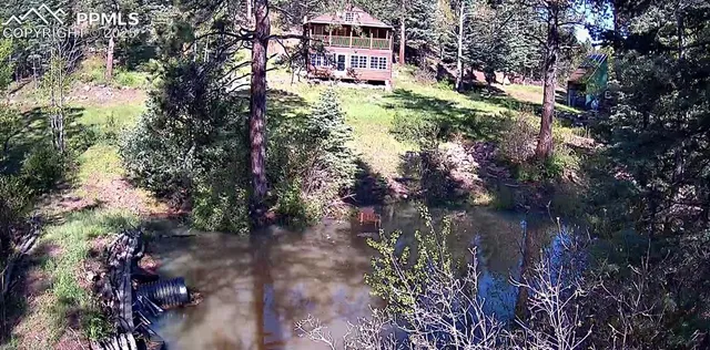 a view of a lake with mountain