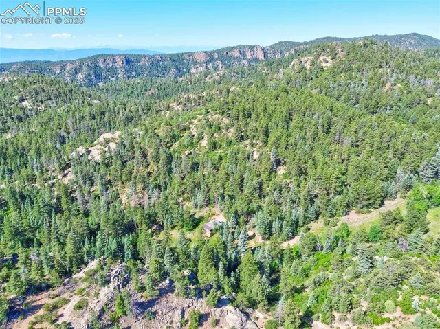 a view of a field with an outdoor space