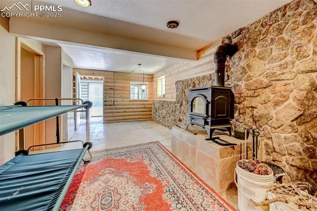 a living room with a rug and a flat screen tv