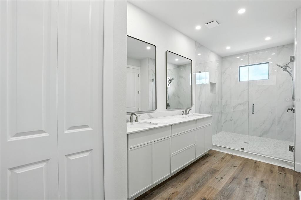 207 Shreve Street Punta Gorda, FL 33950 - Photo 17 of 45 a bathroom with a double vanity sink and mirror