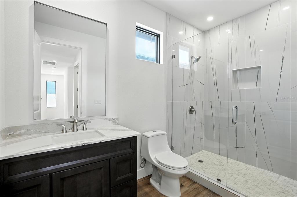 207 Shreve Street Punta Gorda, FL 33950 - Photo 27 of 45 a bathroom with a sink a toilet and shower