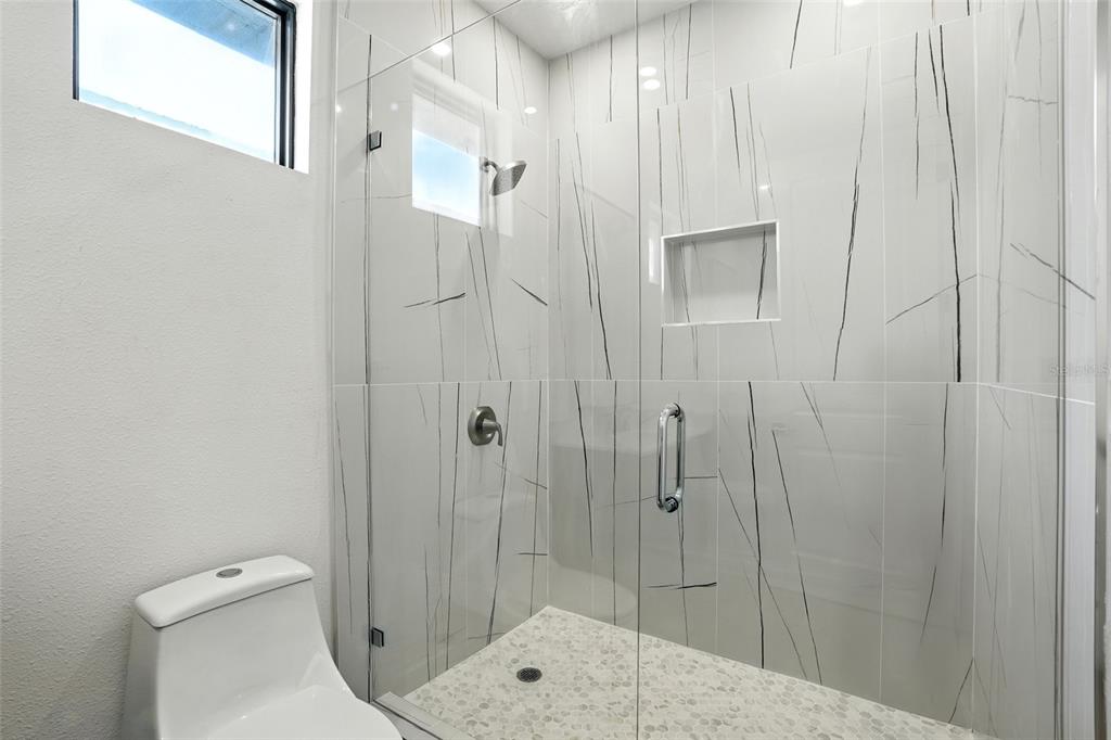 207 Shreve Street Punta Gorda, FL 33950 - Photo 28 of 45 a bathroom with a shower and toilet