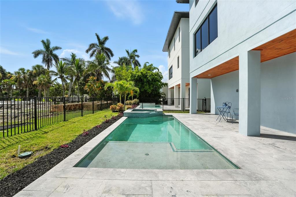 207 Shreve Street Punta Gorda, FL 33950 - Photo 34 of 45 a view of a backyard with couches plants and large tree