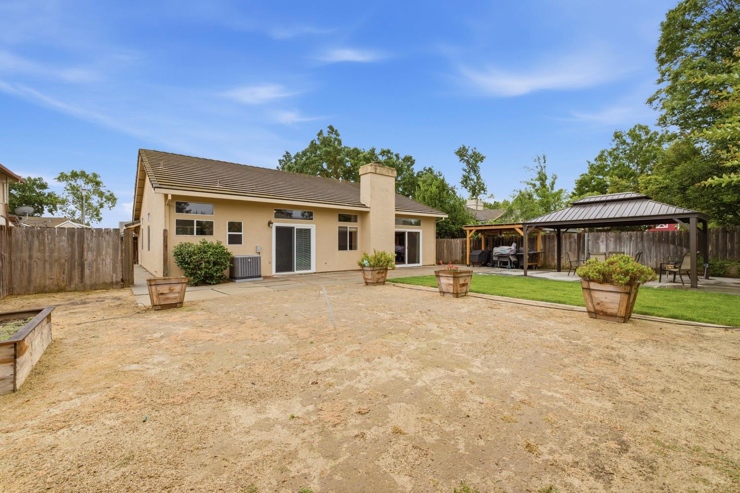 969 Colson Way Galt, CA 95632 - Photo 37 of 38 a front view of a house with a yard and outdoor seating