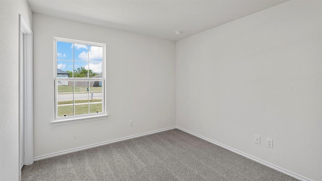 1675 Mantle Road Crandall, TX 75114 - Photo 19 of 27 Neutral wall color with clean white trim