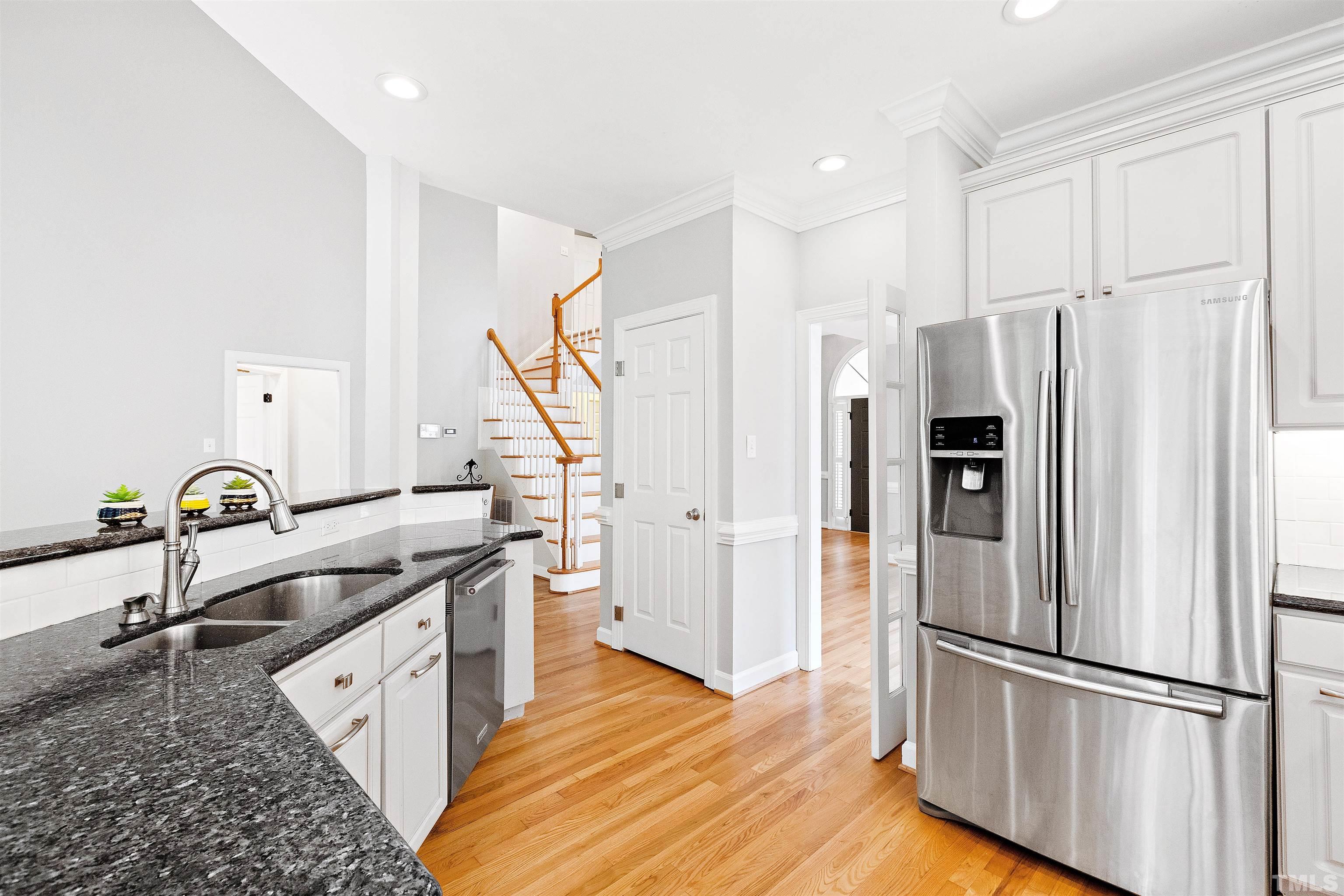 1912 Amity Hill Court Raleigh, NC 27612 - Photo 12 of 36 a kitchen with stainless steel appliances granite countertop a refrigerator and a sink