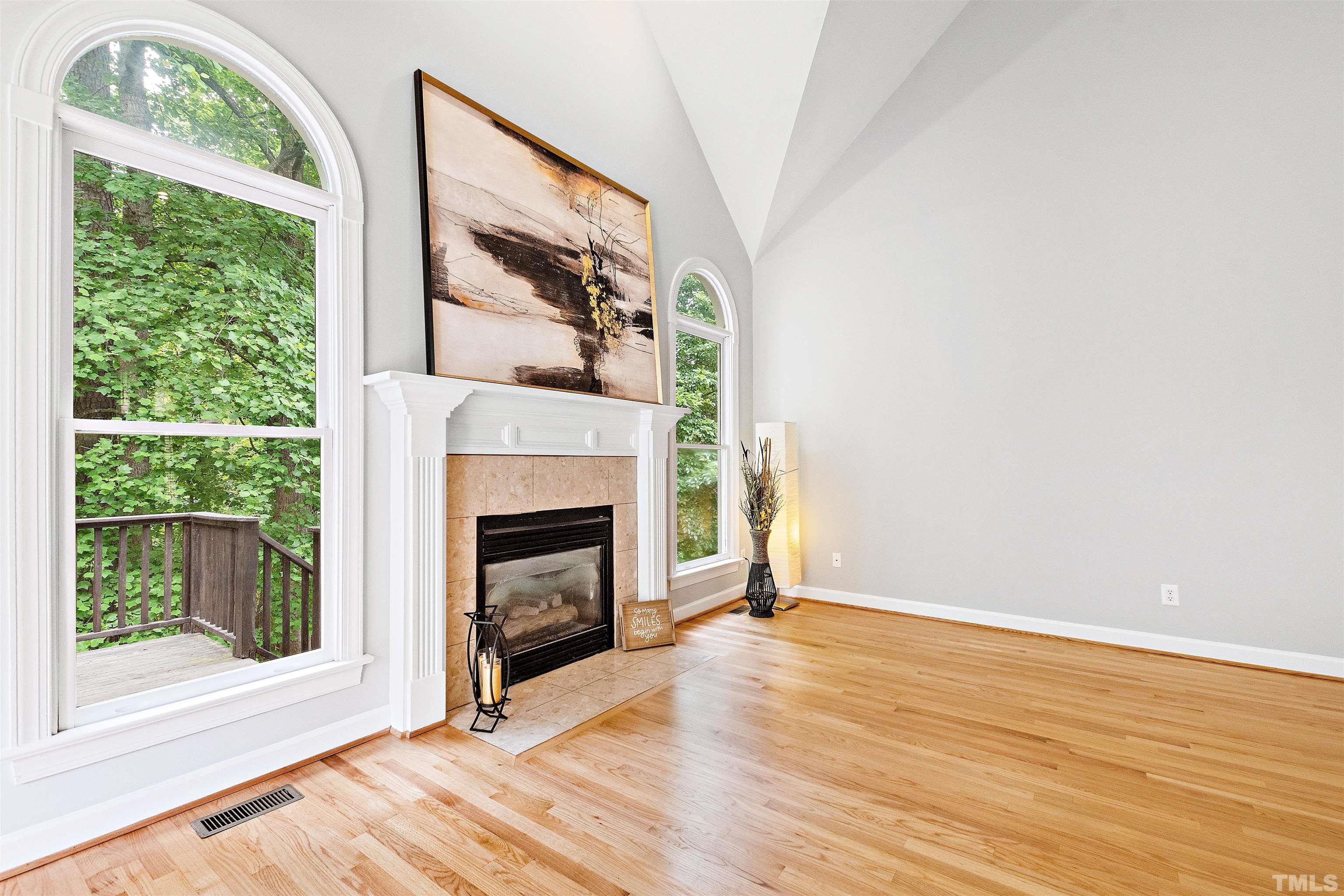 1912 Amity Hill Court Raleigh, NC 27612 - Photo 15 of 36 a view of an empty room with wooden floor and a window