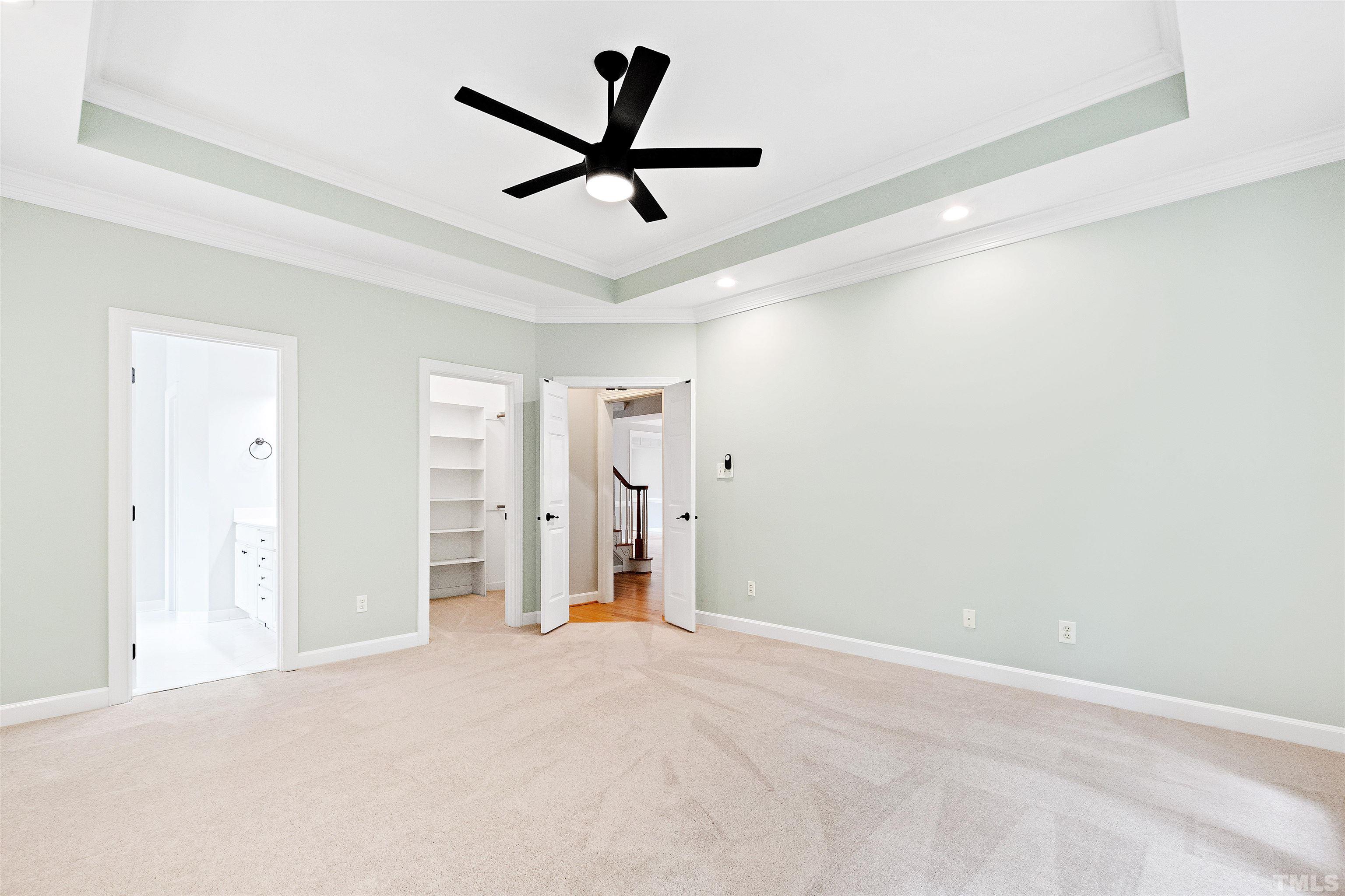 1912 Amity Hill Court Raleigh, NC 27612 - Photo 17 of 36 an empty room with ceiling fan