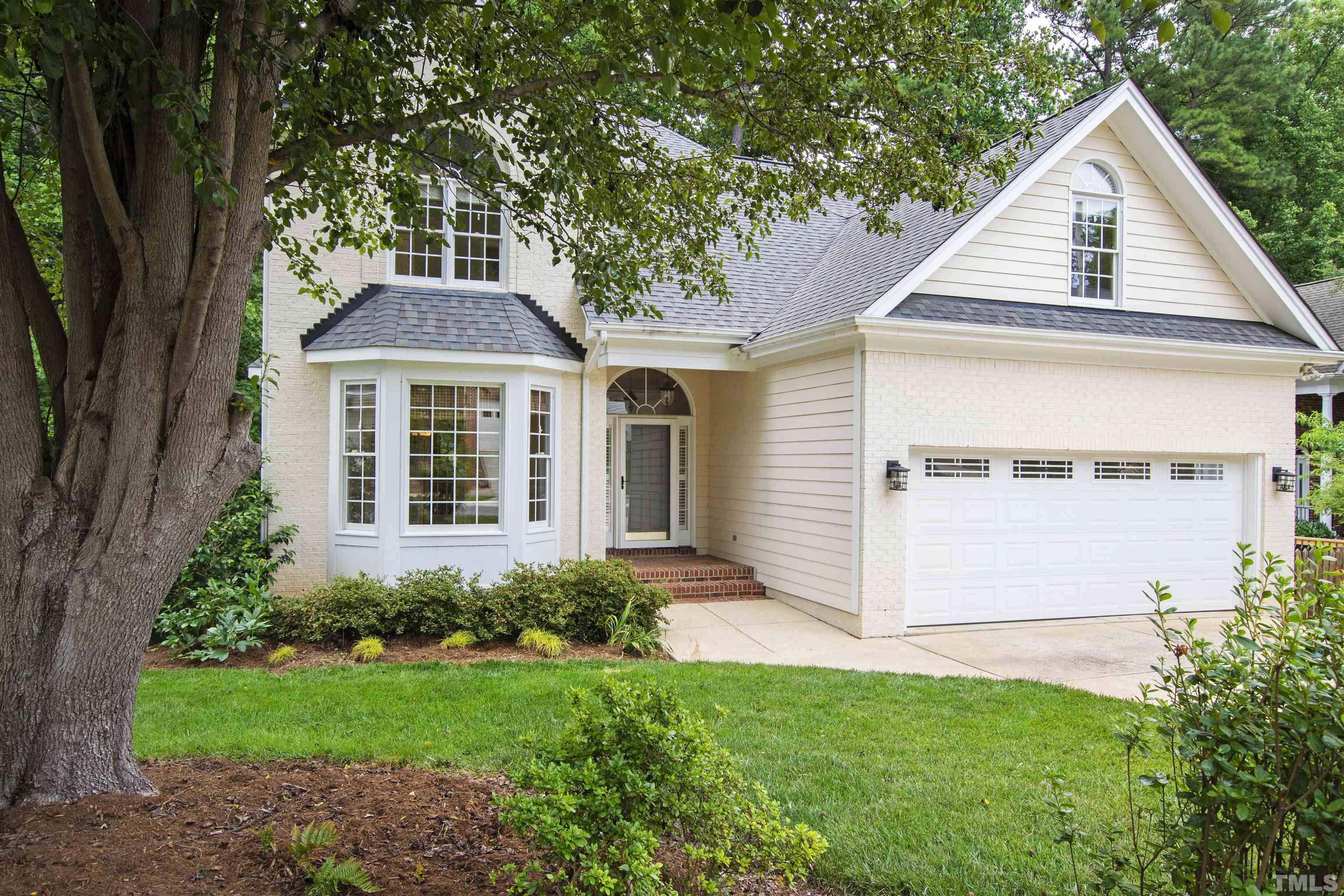 1912 Amity Hill Court Raleigh, NC 27612 - Photo 2 of 36 a front view of a house with a yard