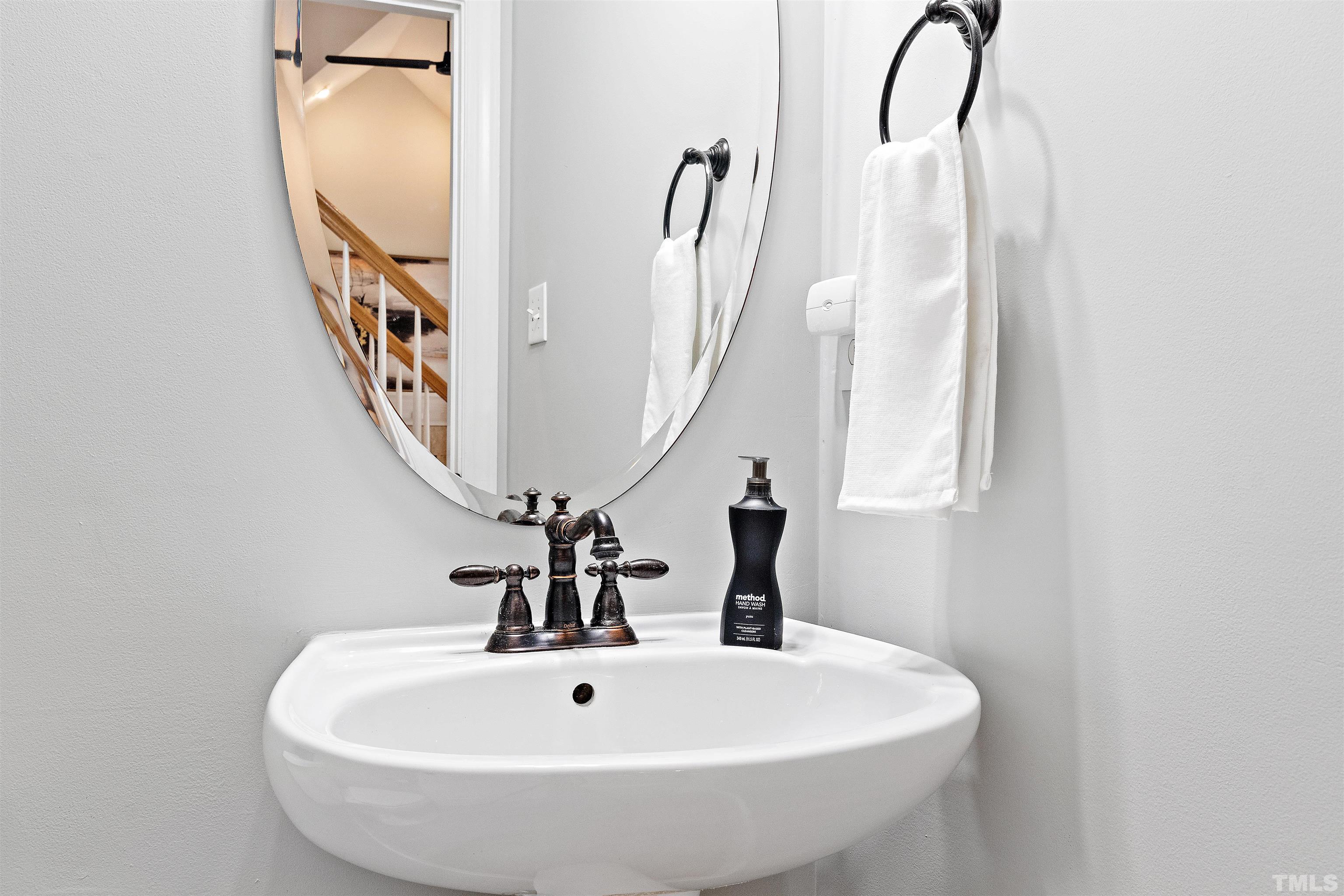 1912 Amity Hill Court Raleigh, NC 27612 - Photo 20 of 36 a bathroom with a sink and a mirror