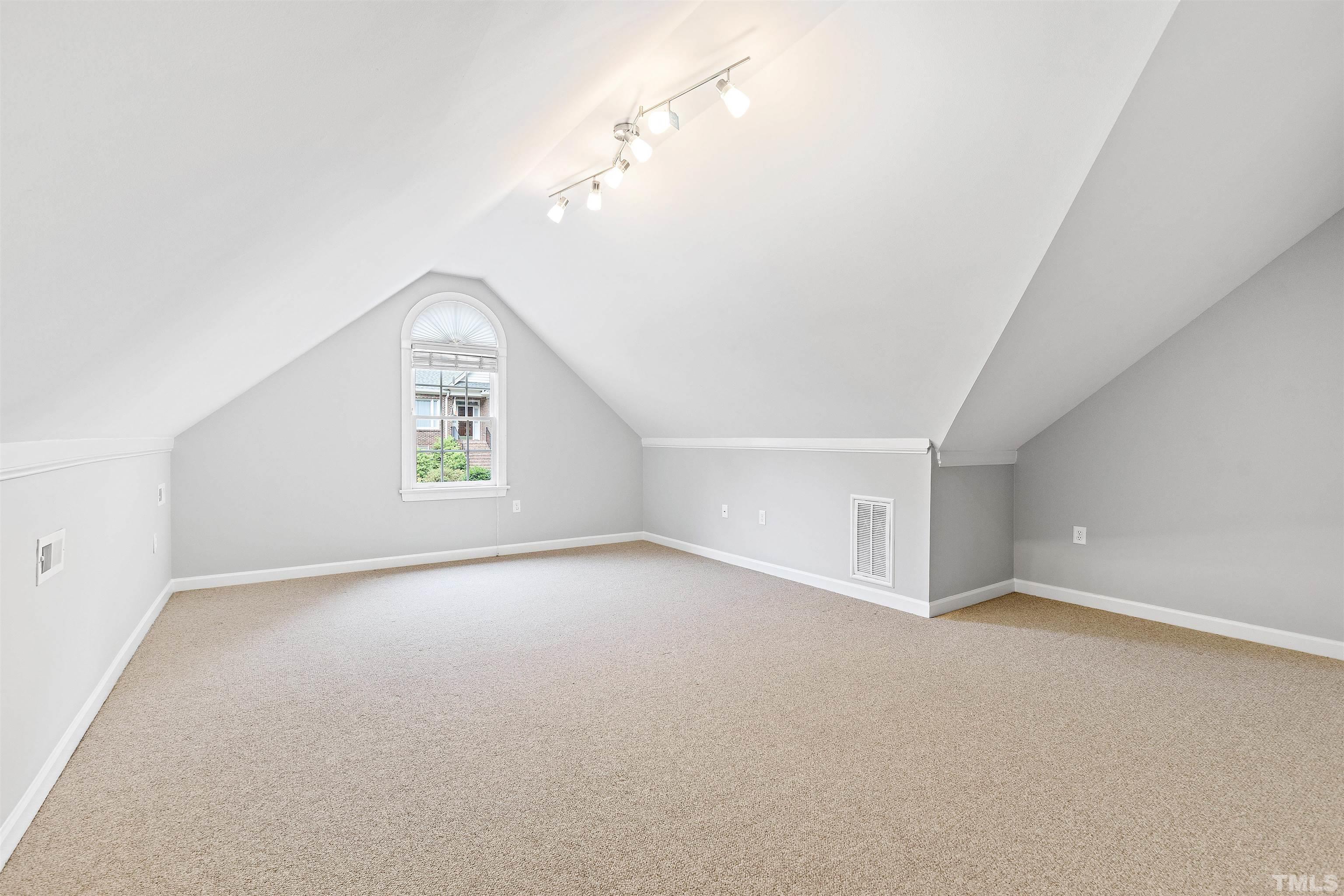 1912 Amity Hill Court Raleigh, NC 27612 - Photo 24 of 36 an empty room with a empty space and windows