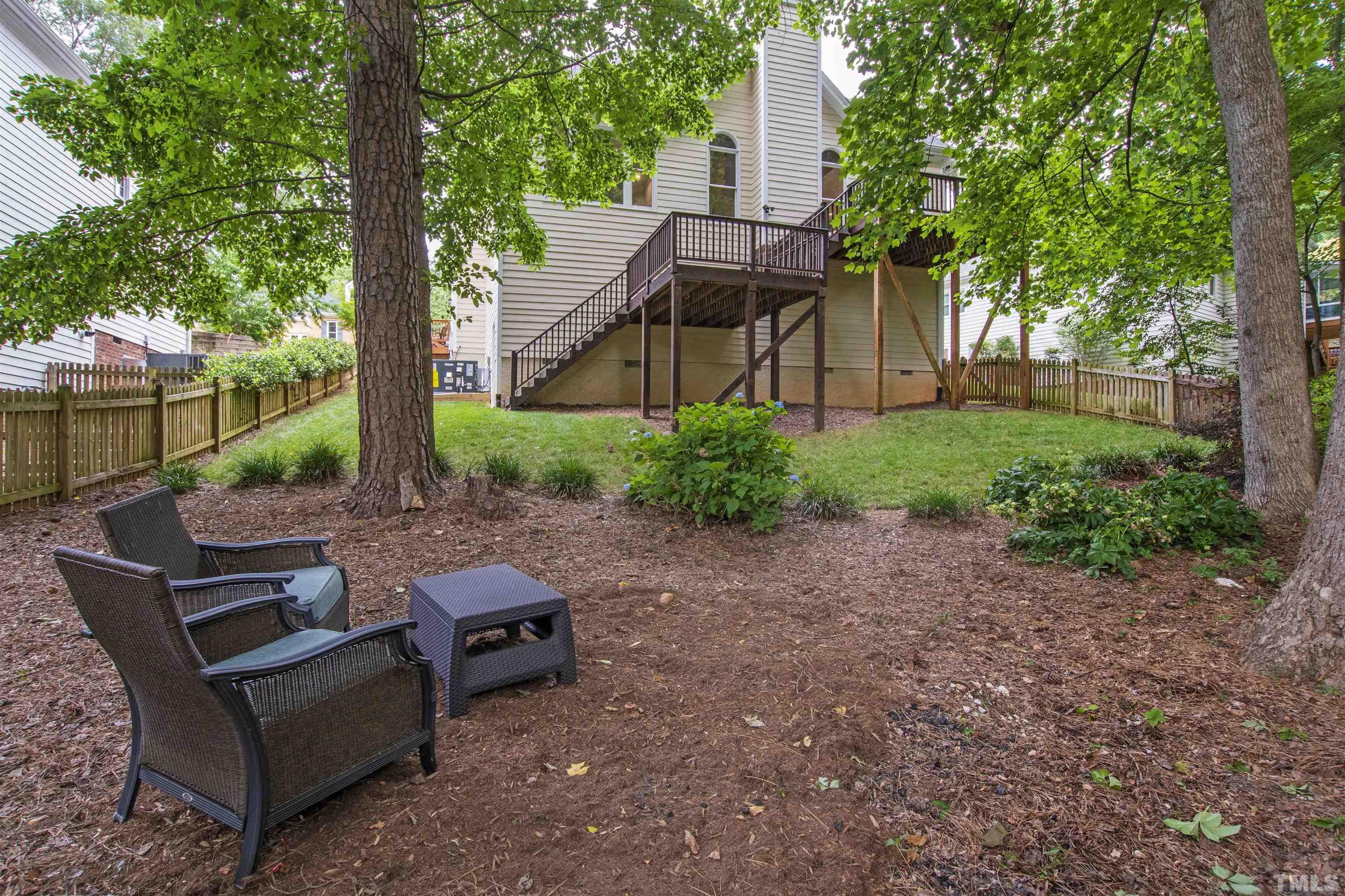 1912 Amity Hill Court Raleigh, NC 27612 - Photo 29 of 36 a view of a backyard with plants and a patio
