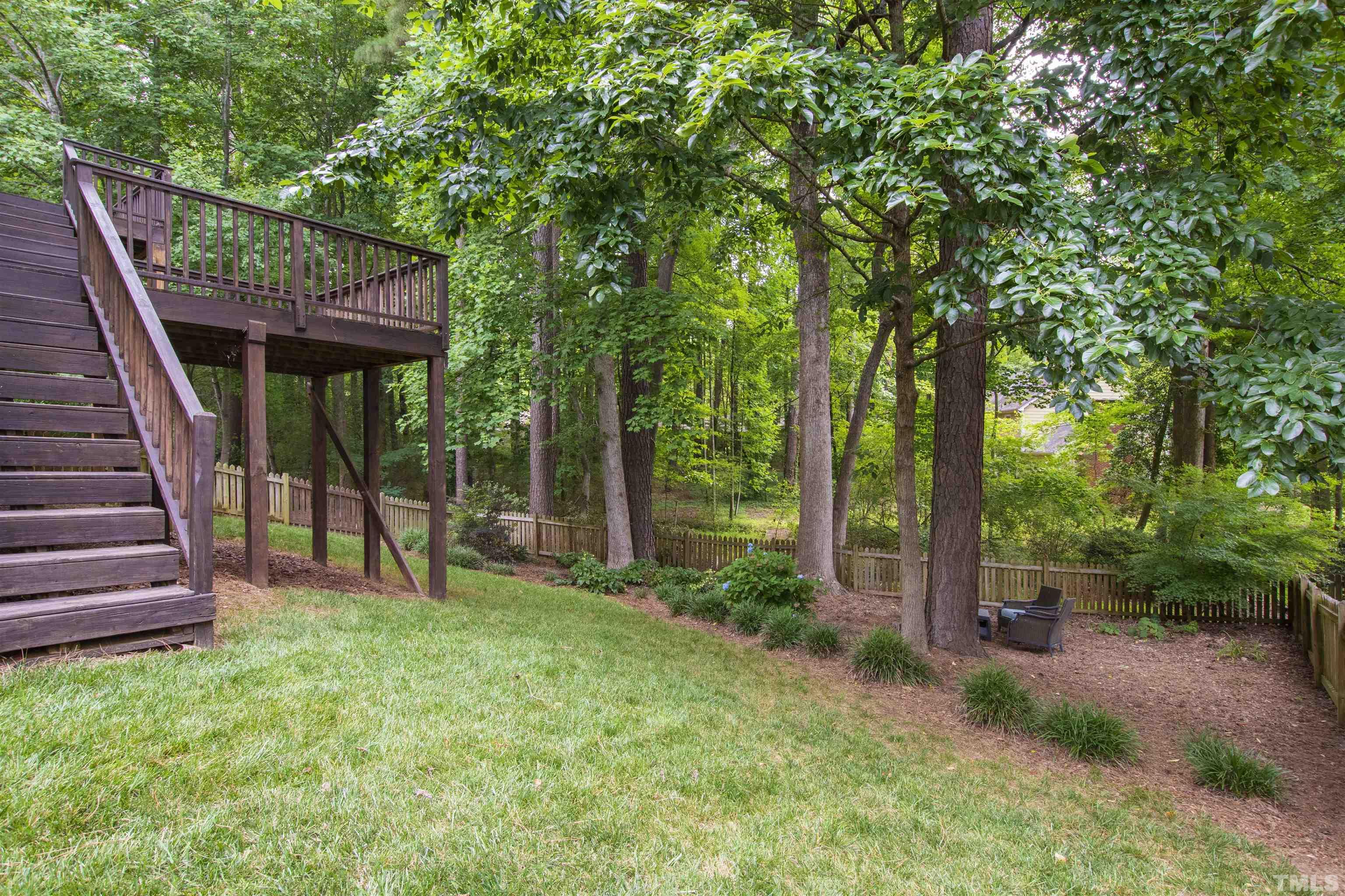 1912 Amity Hill Court Raleigh, NC 27612 - Photo 30 of 36 a view of a backyard with a small cabin and chair
