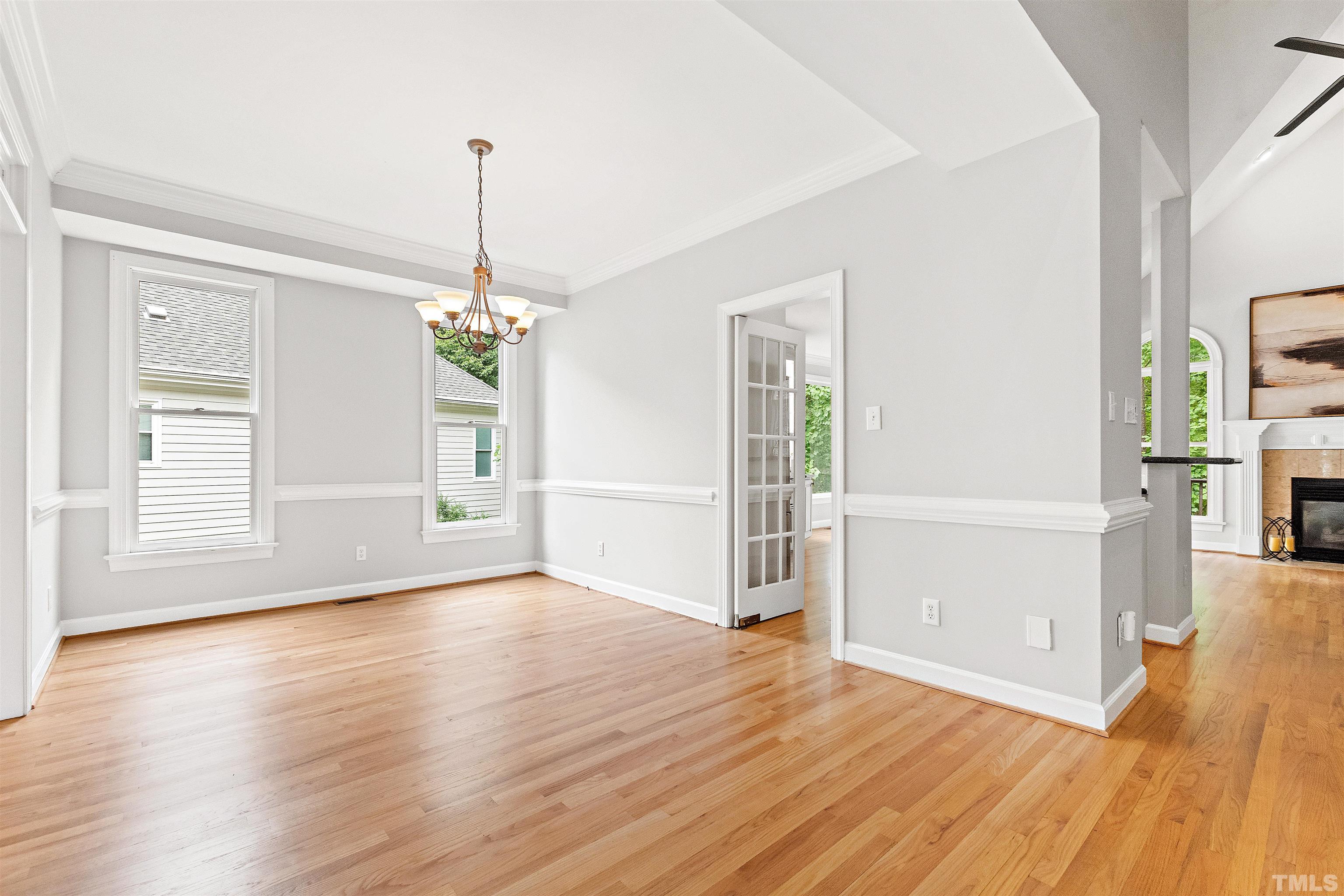 1912 Amity Hill Court Raleigh, NC 27612 - Photo 8 of 36 a view of a room with wooden floor fireplace and windows