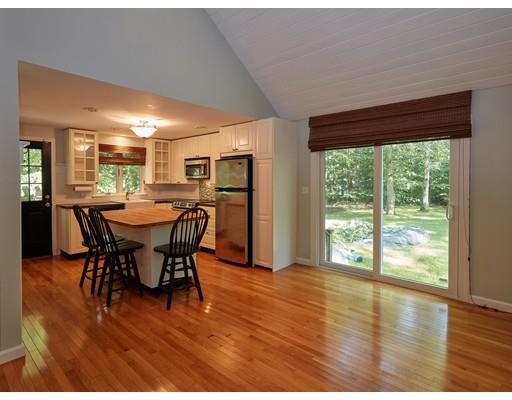 37 Stony Hollow Road Tiverton, RI 02878 - Photo 13 of 30 a view of a dining room with furniture and wooden floor