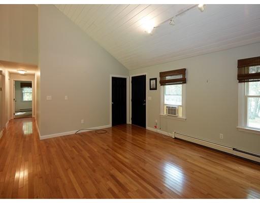 37 Stony Hollow Road Tiverton, RI 02878 - Photo 17 of 30 an empty room with wooden floor and windows