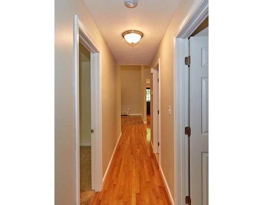 37 Stony Hollow Road Tiverton, RI 02878 - Photo 25 of 30 a view of a hallway with wooden floor