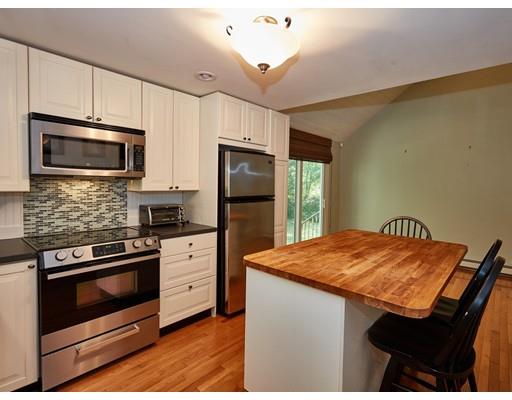 37 Stony Hollow Road Tiverton, RI 02878 - Photo 7 of 30 a kitchen with stainless steel appliances a stove microwave and refrigerator