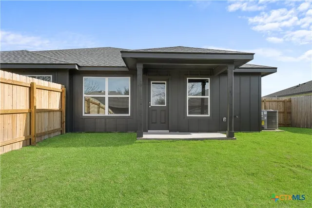 a view of a kitchen with a sink cabinet and a window