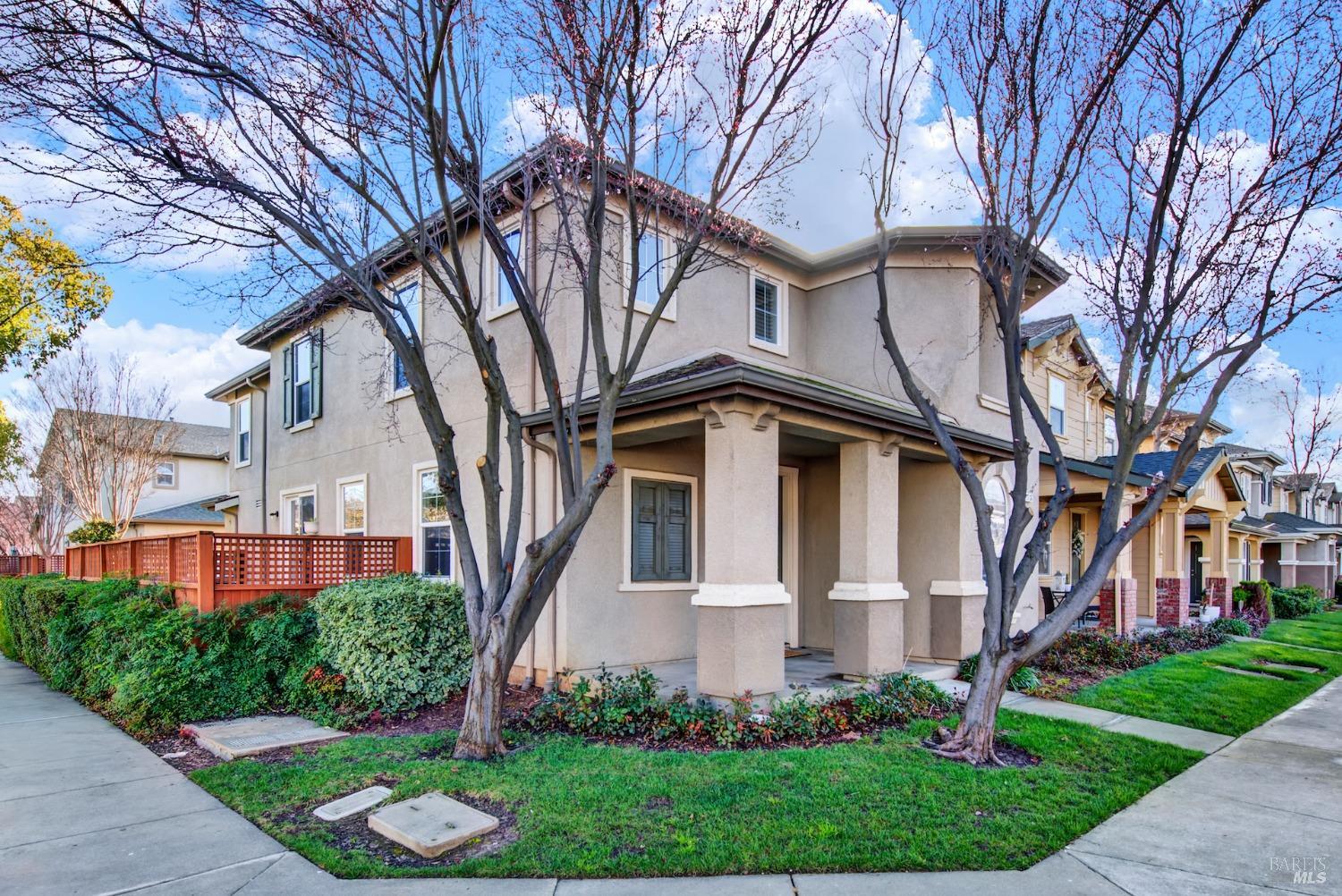 a front view of a house with a garden