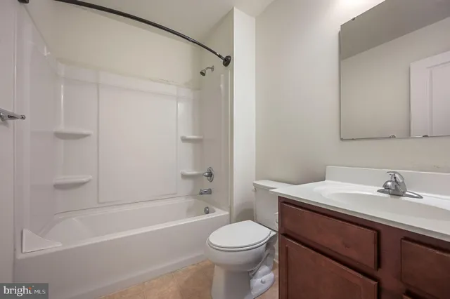 a bathroom with a sink a toilet and a bathtub
