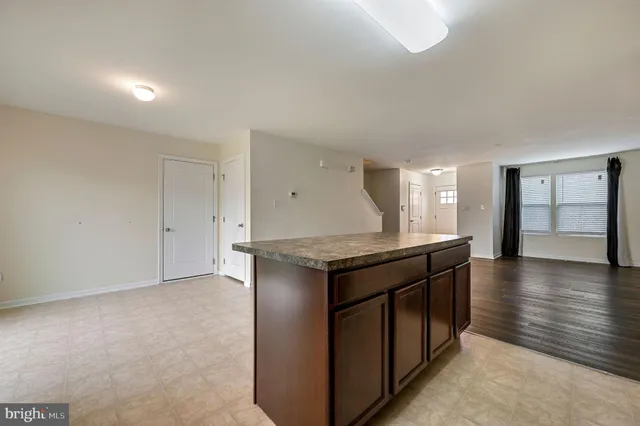 a kitchen with stainless steel appliances granite countertop a stove and a refrigerator