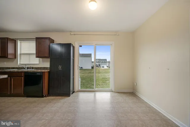 a view of a kitchen with a sink