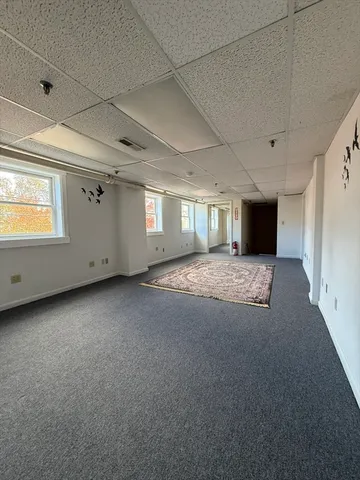 a view of an empty room with windows