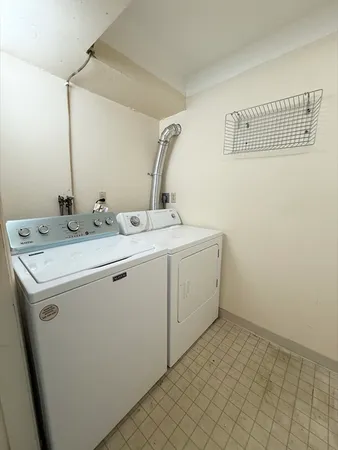 a utility room with a sink a washer and dryer