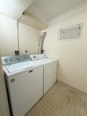 a utility room with a sink a washer and dryer