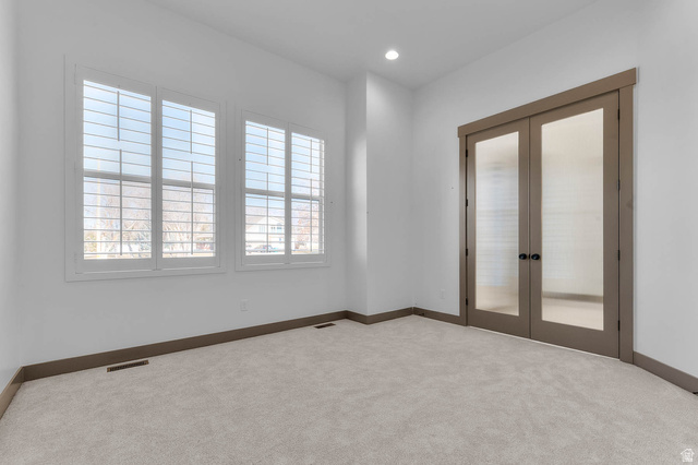 2724 Mt Jordan Road Sandy, UT 84092 - Photo 9 of 33 Carpeted spare room with french doors and recessed lighting