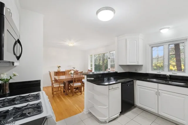 a bedroom with a bed dresser and a window