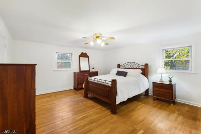 a bed room with bed and a chandelier