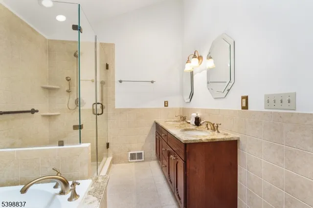 a bedroom with furniture and wooden floor