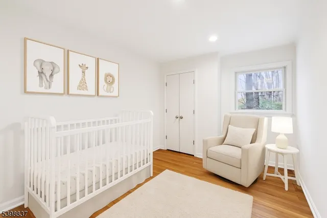 a view of room with window and wooden floor