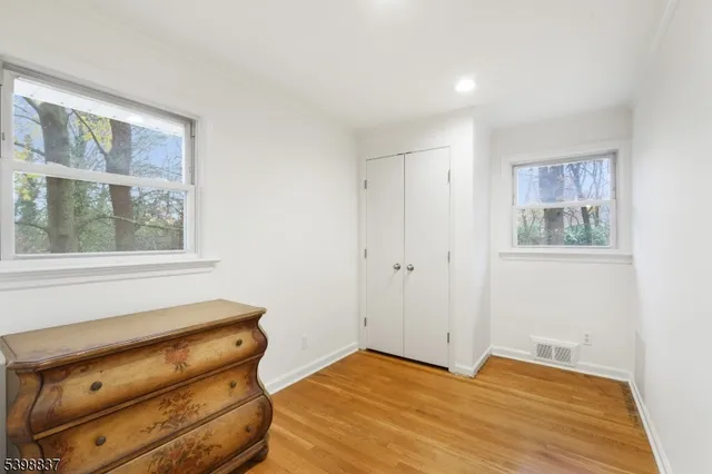 a room with a bed and a window