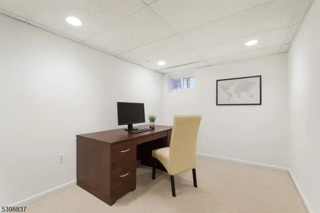 front view of a house with a big yard and large trees