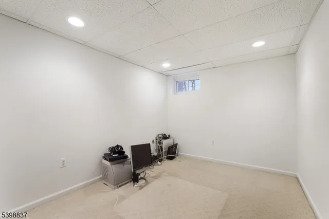 a view of a house with a yard and tree s