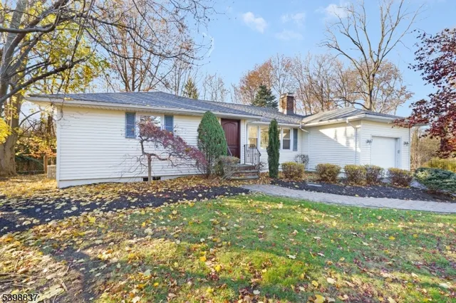 a picture of a wall with a white wall and a white refrigerator