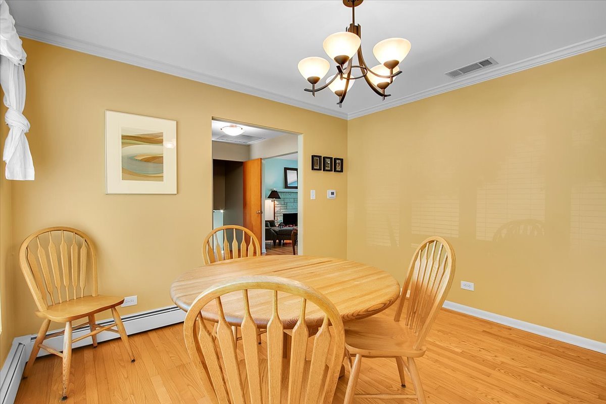 443 Lombard Road Itasca, IL 60143 - Photo 12 of 43 a view of a dining room with furniture and chandelier